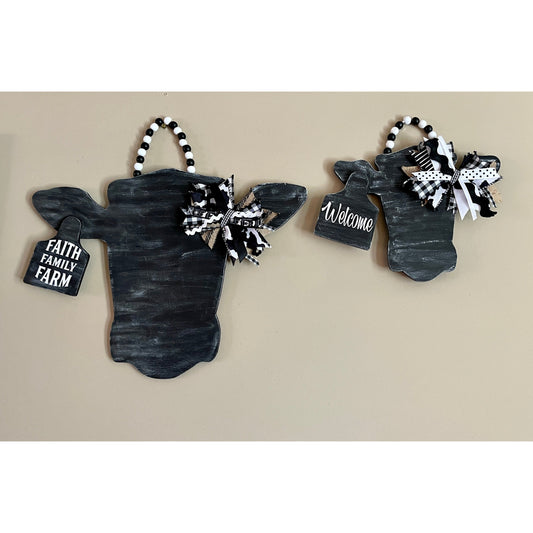 Large and Small Distressed Black Cow Heads